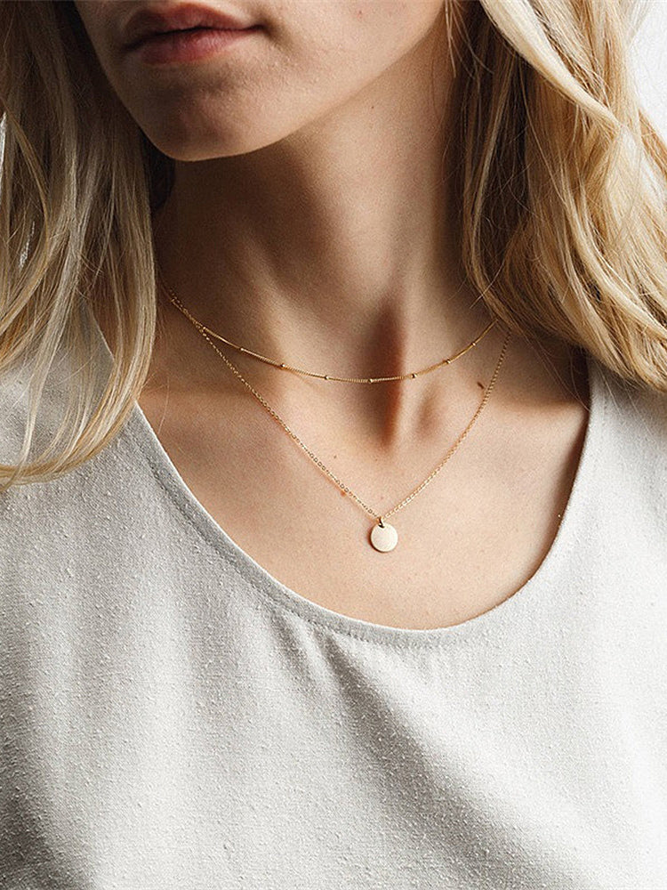 gold beaded necklace — view 1