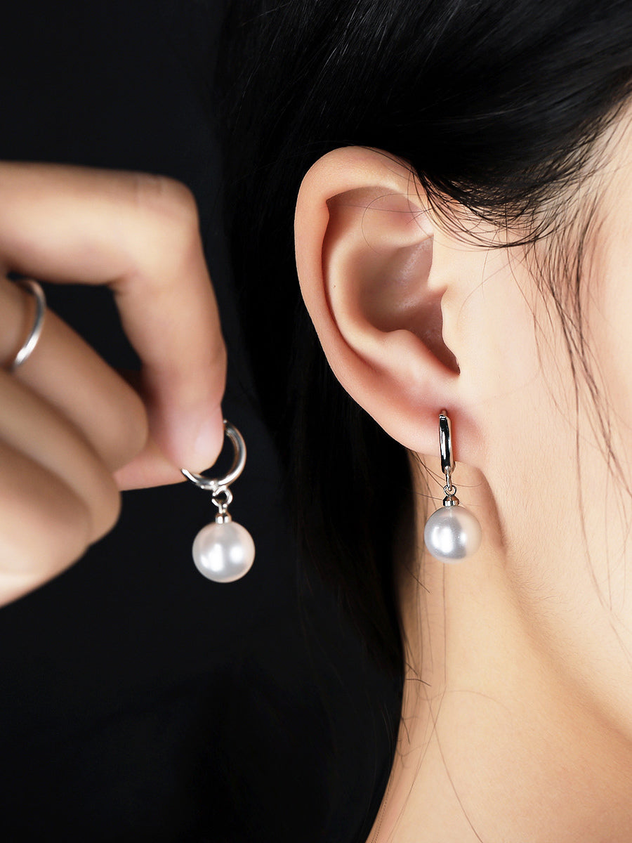 gold earrings — view 1