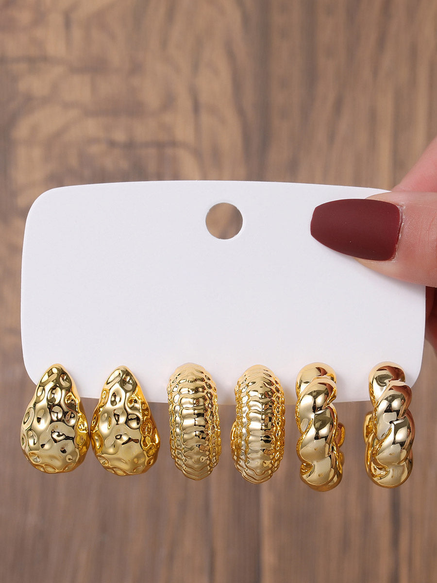 gold earrings — view 1
